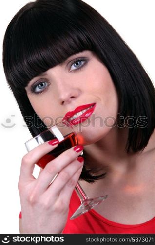 Portrait of a woman with glass of rose wine