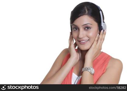 Portrait of a woman with headphones listening to music