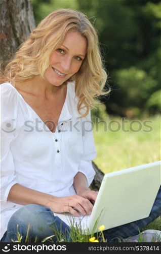 Portrait of a woman with laptop