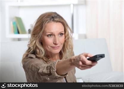 portrait of a woman with remote control