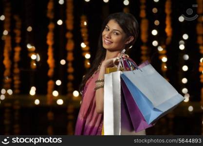 Portrait of a woman with shopping bags