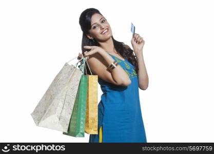 Portrait of a woman with shopping bags and credit card