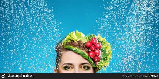 Portrait of a woman with vegetables on head