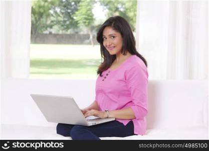 Portrait of a woman working on a laptop