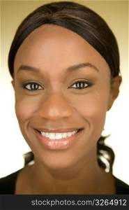Portrait of a young African American woman smiling at the camera