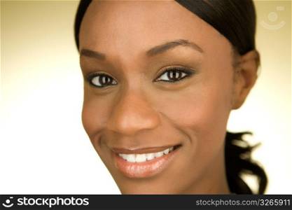 Portrait of a young African American woman smiling at the camera