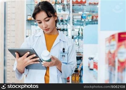 Portrait of a young asian female pharmacist and qualified pharmaceutical, medicine pill container or bottle mockup for copyspace at pharmacy. Drugstore concept with various medicine box in background.. Portrait young asian female pharmacist pill bottle mockup at qualified pharmacy