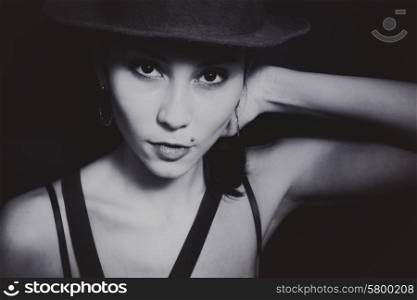 Portrait of a young Asian woman in a hat closeup
