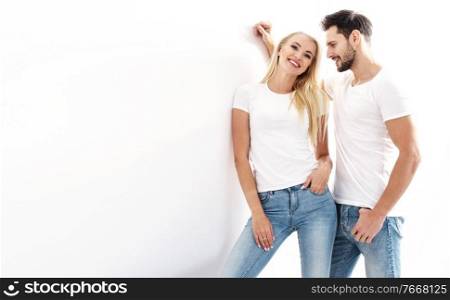 Portrait of a young, attractive couple wearing casual clothes - isolated
