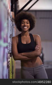 portrait of a young beautiful African American women in sports clothes after a workout at the gym