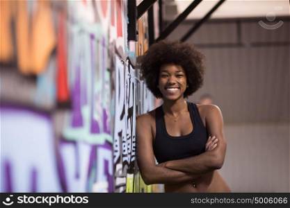 portrait of a young beautiful African American women in sports clothes after a workout at the gym