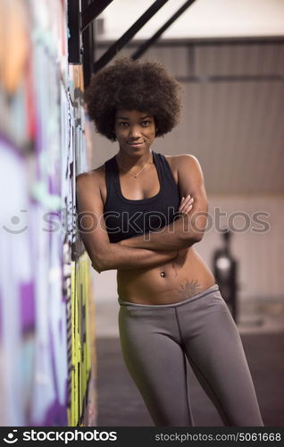 portrait of a young beautiful African American women in sports clothes after a workout at the gym