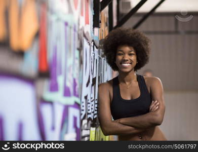 portrait of a young beautiful African American women in sports clothes after a workout at the gym