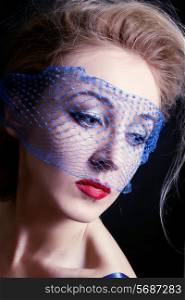 Portrait of a young beautiful blue-eyed women in veils closeac