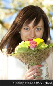 portrait of a young beautiful bride with a bouquet