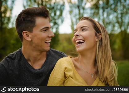 Portrait of a young beautiful couple laughing