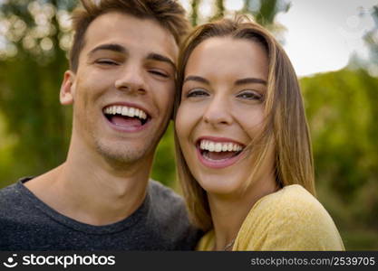 Portrait of a young beautiful couple laughing