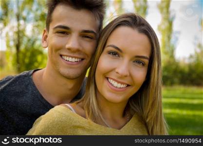 Portrait of a young beautiful couple smiling