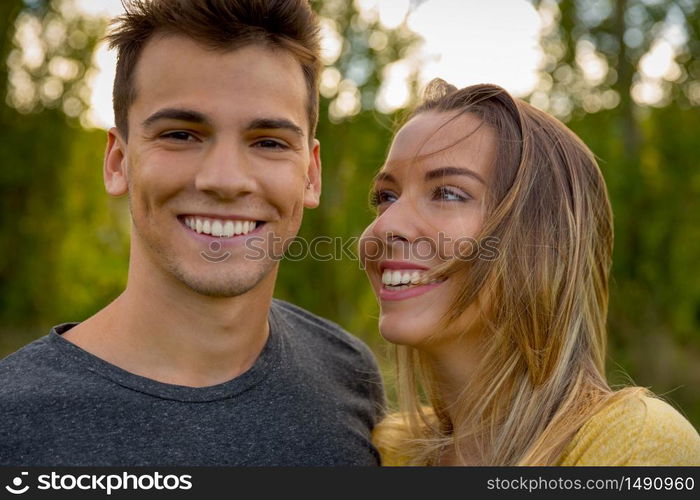 Portrait of a young beautiful couple smiling