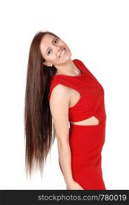 Portrait of a young beautiful woman in a red dress head back with her long brunette hair, looking into camera, isolated for white background