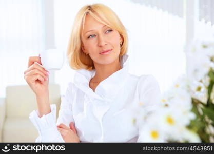 POrtrait of a young beautiful woman in business wear at work