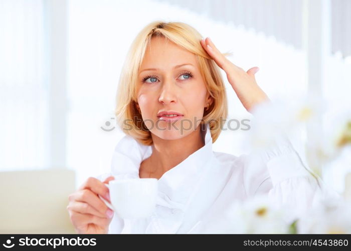 POrtrait of a young beautiful woman in business wear at work