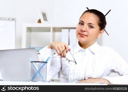 POrtrait of a young beautiful woman in business wear at work