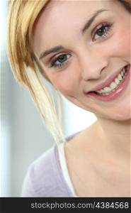 Portrait of a young blond woman cheerful