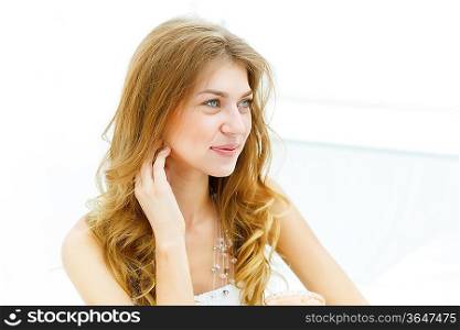 Portrait of a young blond woman sitting in cafe