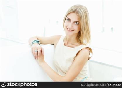 Portrait of a young blond woman sitting in cafe