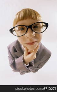 Portrait of a young boy dressed as a businessman