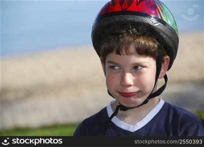 Portrait of a young boy in a bicycle helmet