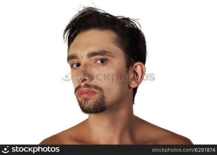 Portrait of a young brunette man with a stylish haircut