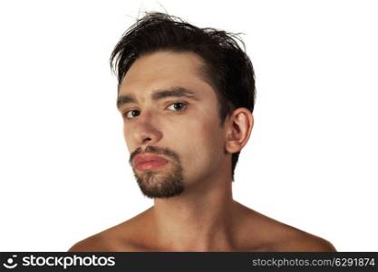 Portrait of a young brunette man with a stylish haircut