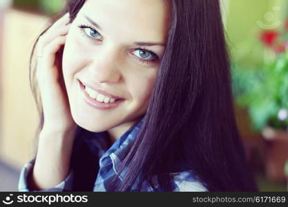 portrait of a young brunette woman with long beautiful hair close-up