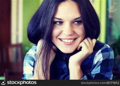 portrait of a young brunette woman with long beautiful hair close-up