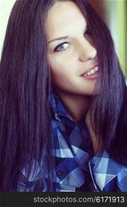 portrait of a young brunette woman with long beautiful hair close-up
