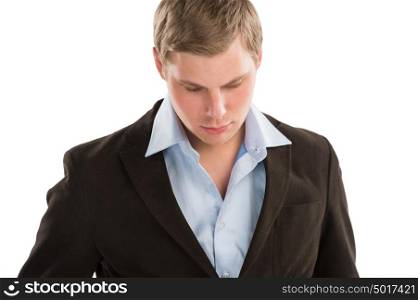 Portrait of a young business man looking away and thinking