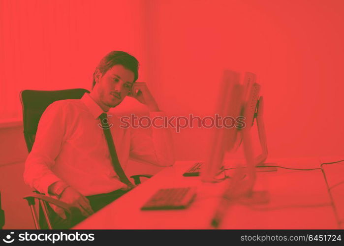 Portrait of a young business man looking depressed and worried from work at meeting office indors duo tone