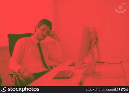 Portrait of a young business man looking depressed and worried from work at meeting office indors duo tone