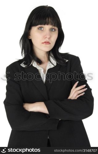 Portrait of a young business woman with arms crossed.