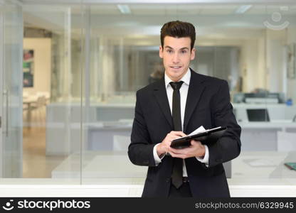 Portrait of a young businessman in an office