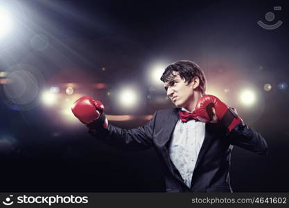 Portrait of a young businessman. Portrait of a young businessman boxing. conceptual collage