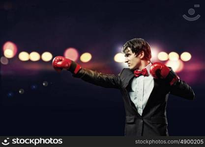 Portrait of a young businessman. Portrait of a young businessman boxing. conceptual collage