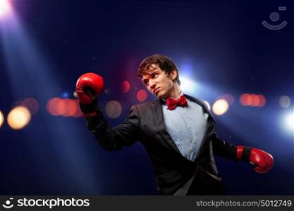Portrait of a young businessman. Portrait of a young businessman boxing. conceptual collage