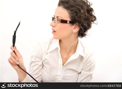 Portrait of a young businesswoman holding a plug