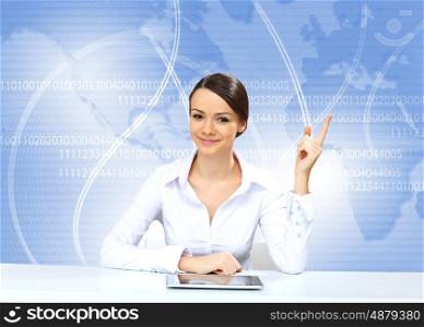 Portrait of a young businesswoman making presentation