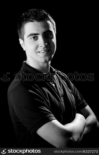 Portrait of a young casual man on black background