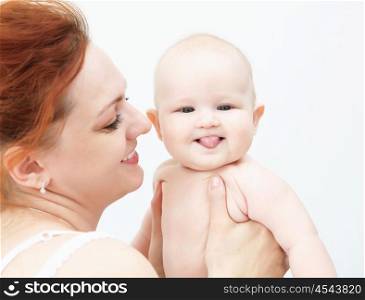 Portrait of a young child and his mother a white background. Baby.
