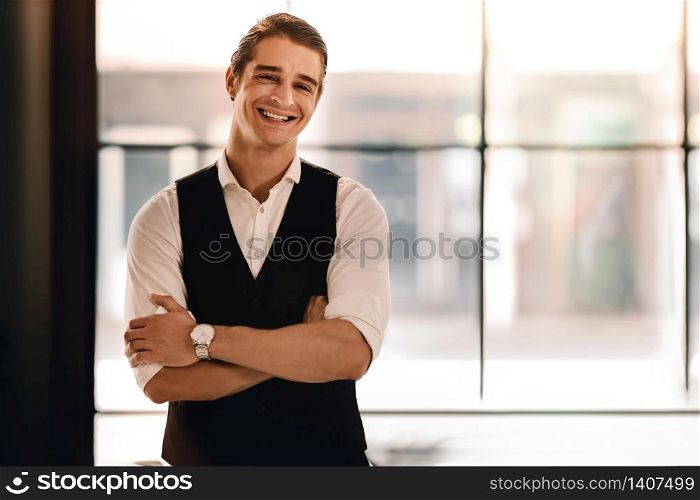 Portrait of a Young Confident CEO or Leader in the Office. Smiling Businessman in Comfortable Posture